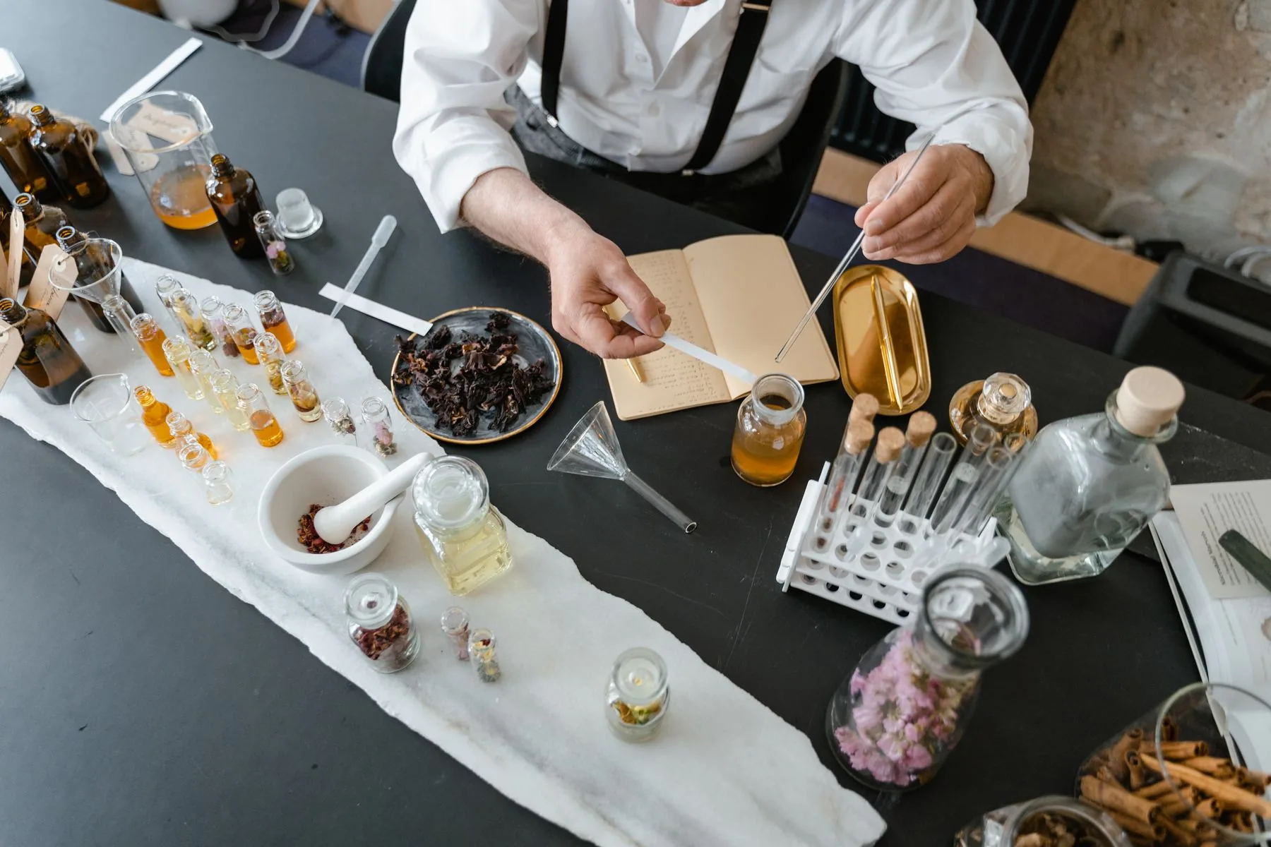 A fragrance specialist working with botanical extracts